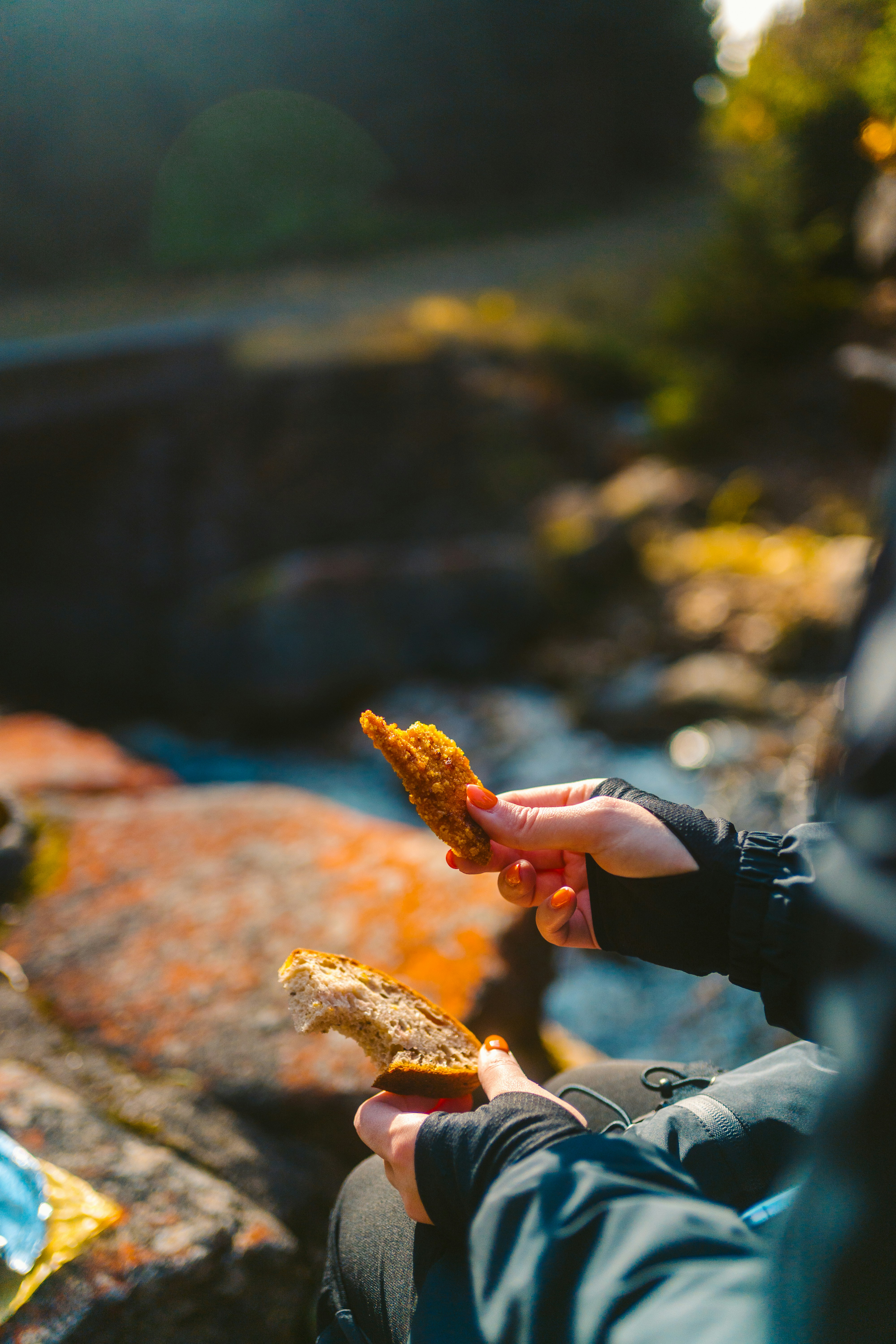 Taking a snack break on the trail — bread and energy food on the rocks